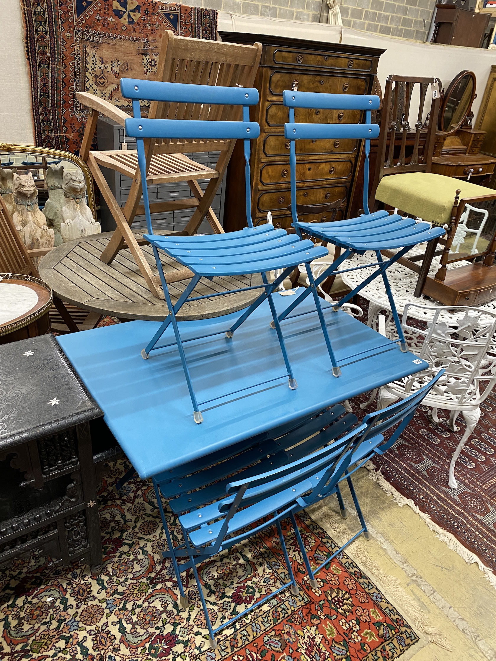 An Italian EMU furniture rectangular blue metal folding garden table, length 110cm, depth 70cm, height 74cm and four chairs